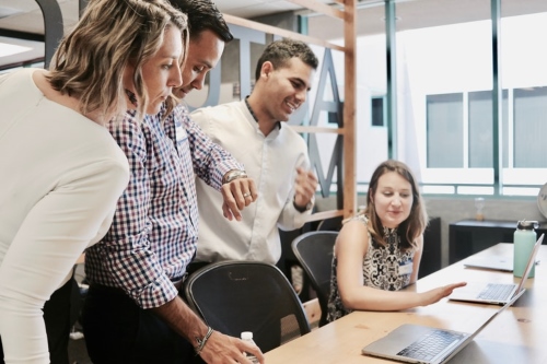 Teachers having a discussion with laptop 