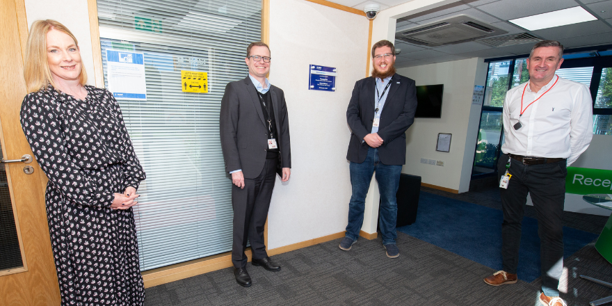 Dr Leigh Hoath (far left) stands with male colleagues from BASF at opening of ScienceXperience