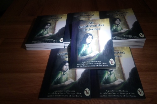 Pile of books laid out on a desk